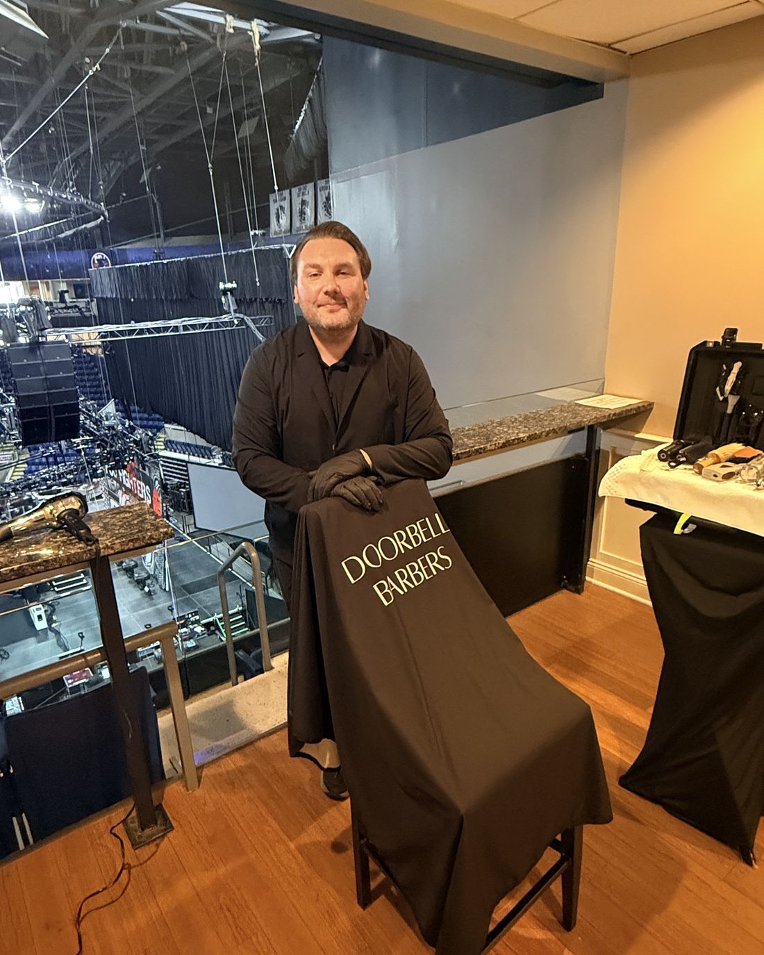 Christian Patrick, founder of Doorbell Barbers, in a backstage suite overlooking the arena bowl