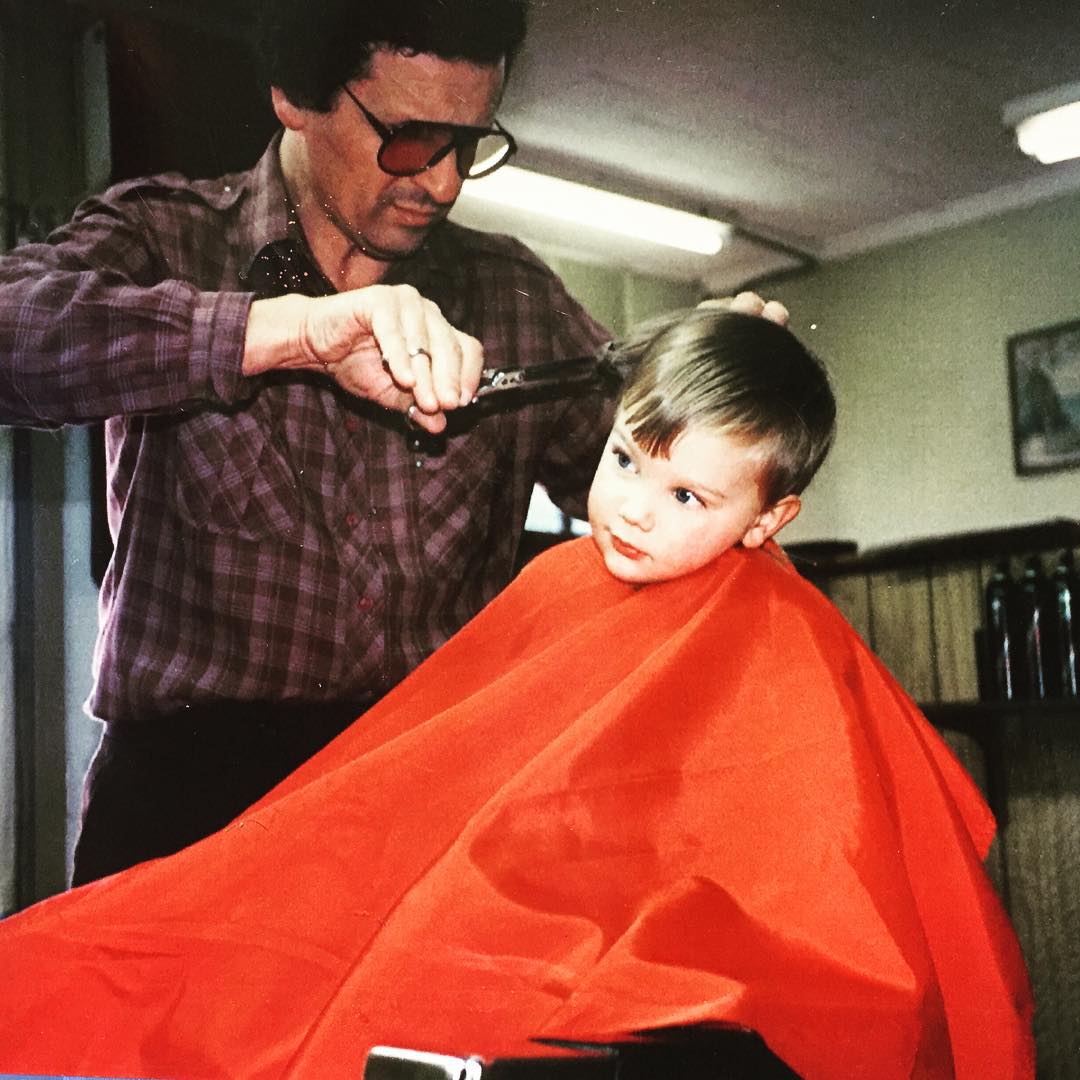 Joe Iannucci, founder Christian Iannucci's grandfather, cutting a young boy's hair in his Connecticut barbershop