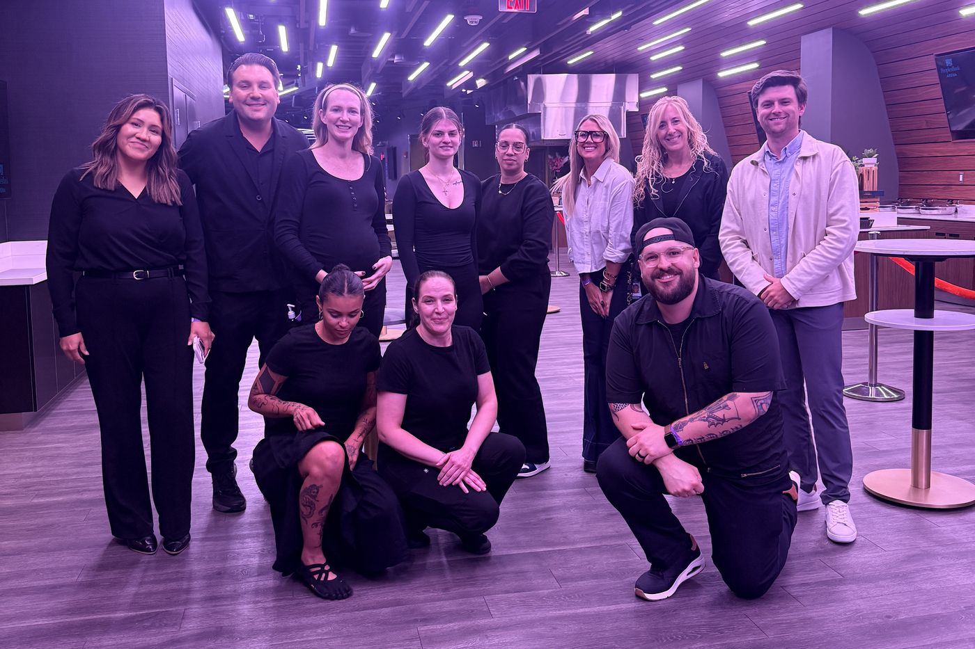 The Doorbell Barbers team with PeoplesBank Arena staff in Hartford, Connecticut